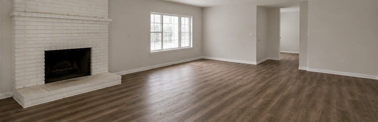 The same living room cleared out, painted and refloored